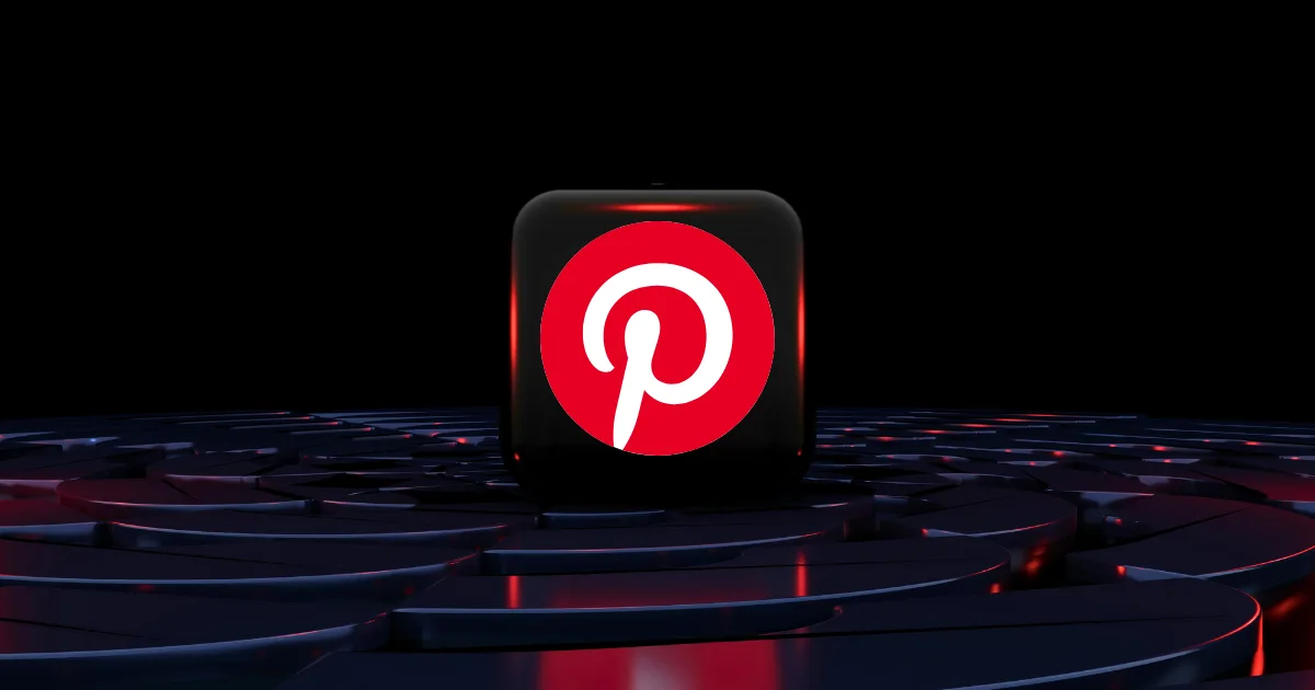 A black cube with the Pinterest logo, symbolizing Pinterest traffic, sits on a glossy, abstract dark surface with red and blue highlights, set against a black background.