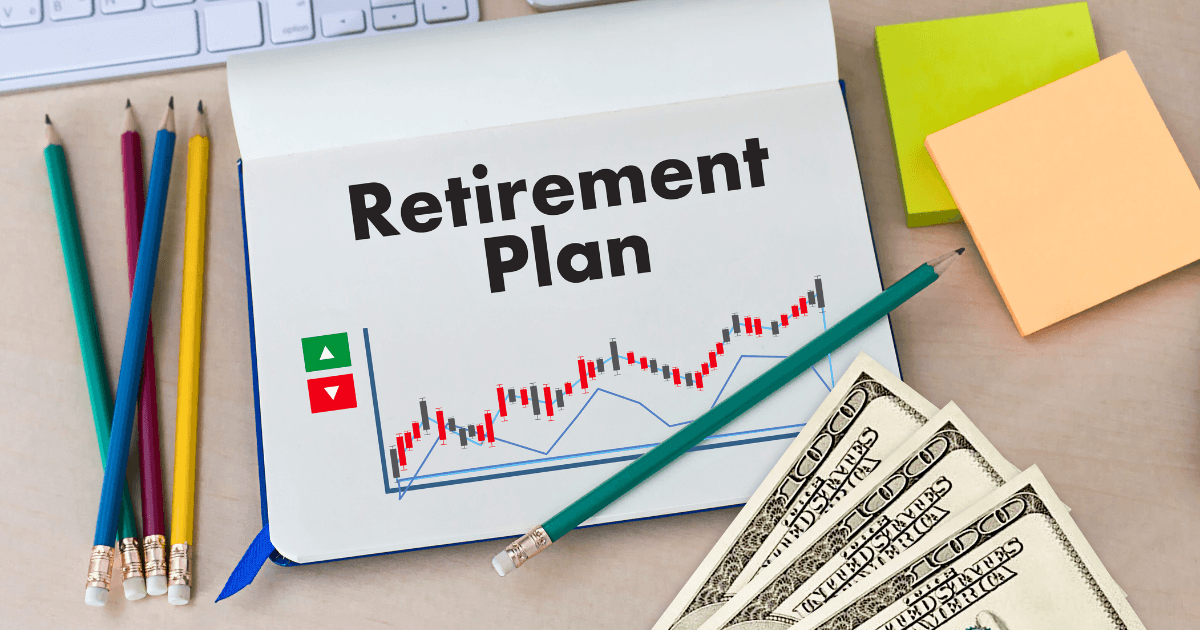 An open notebook with "Retirement Plan" written above a stock chart, surrounded by colored pencils, US $100 bills, sticky notes, and a computer keyboard—perfect for comparing Solo 401k vs SEP IRA vs SIMPLE IRA options.