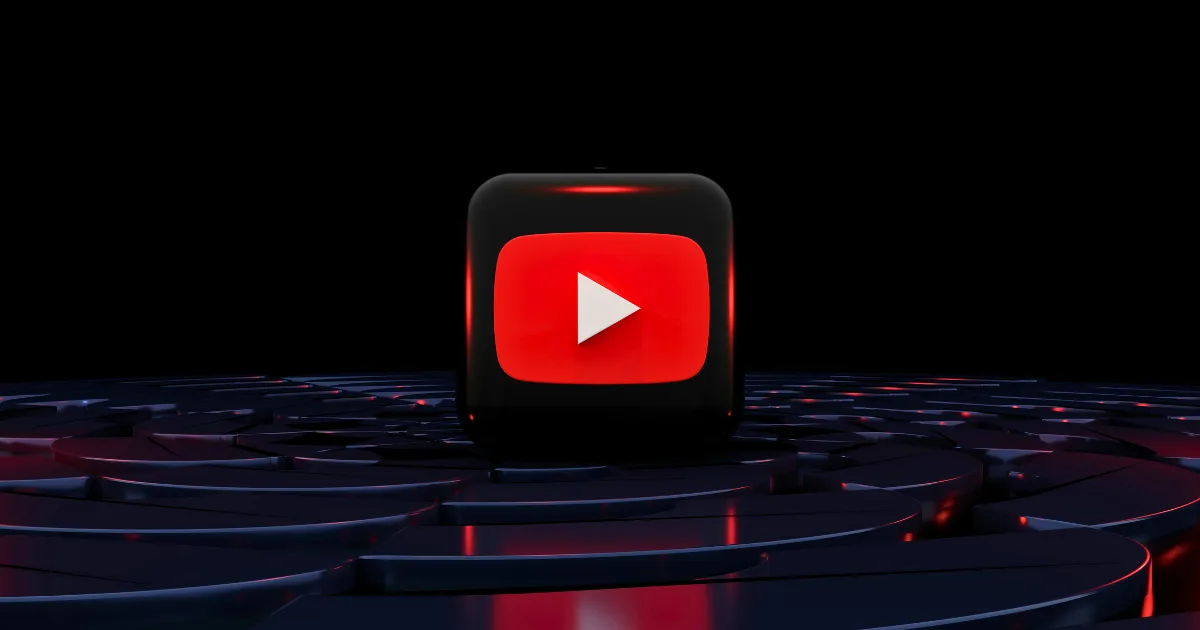 A 3D YouTube play button icon glowing red stands on a dark, glossy, circular patterned surface with red and blue reflections, symbolizing a powerful YouTube growth strategy against a black background.