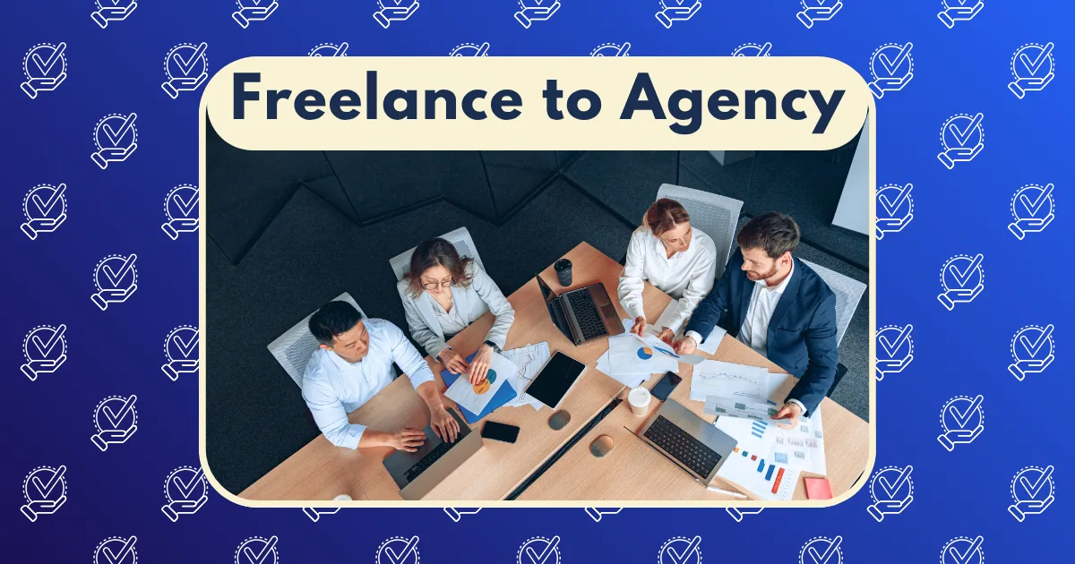 Top-down view of four people collaborating at a table with laptops, documents, and coffee cups. Text above reads “Freelance to Agency” on a blue background with light checkmark patterns, highlighting the freelance to agency journey.