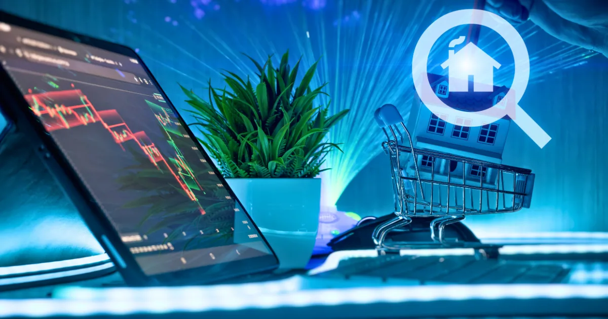A tablet displaying stock charts sits beside a small potted plant and a tiny house in a miniature shopping cart, with a magnifying glass and house icon overlay, highlighting personal investment strategy in real estate.