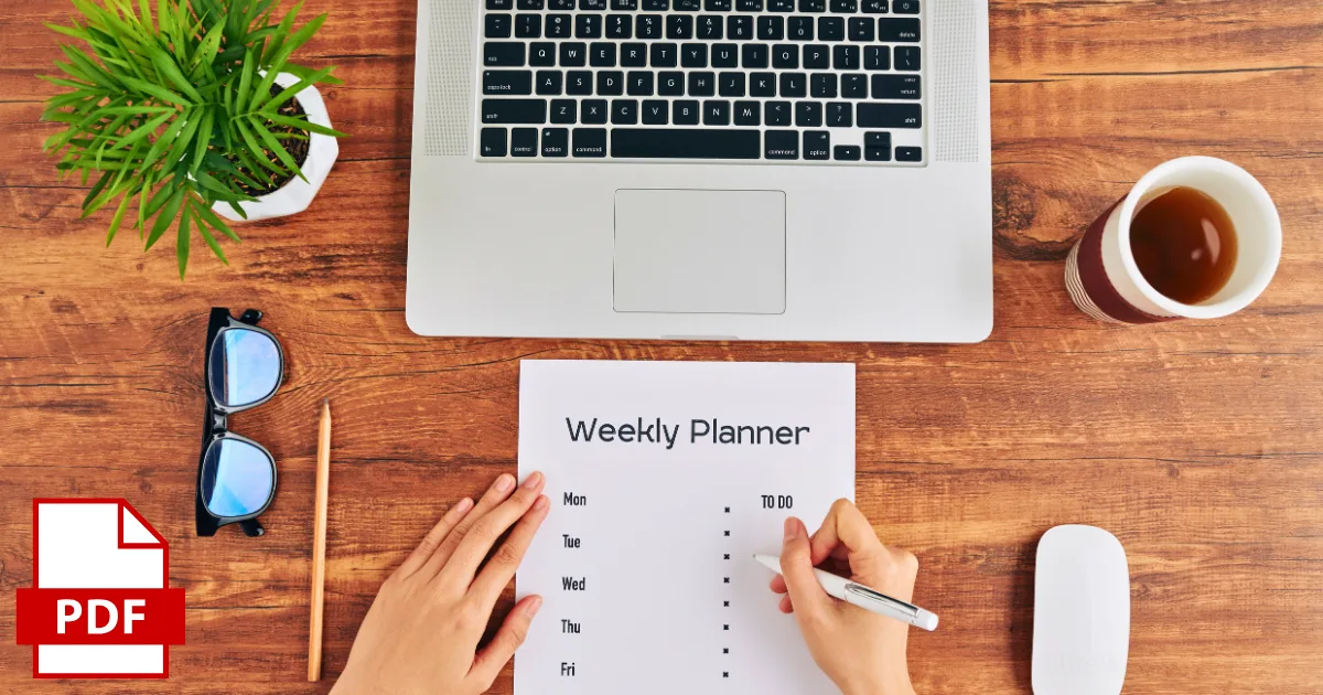A person writes on a weekly planner sheet at a wooden desk with a laptop, coffee, and glasses. A PDF icon in the corner hints at printable planners—perfect for those interested in printables that sell.