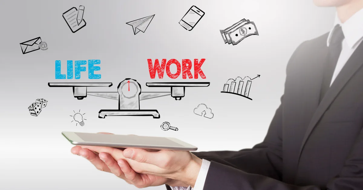A person in a suit holds a tablet with illustrations above it showing a balanced scale labeled LIFE and WORK, surrounded by icons of money, graphs, and daily essentials, symbolizing healthy work-life boundaries.