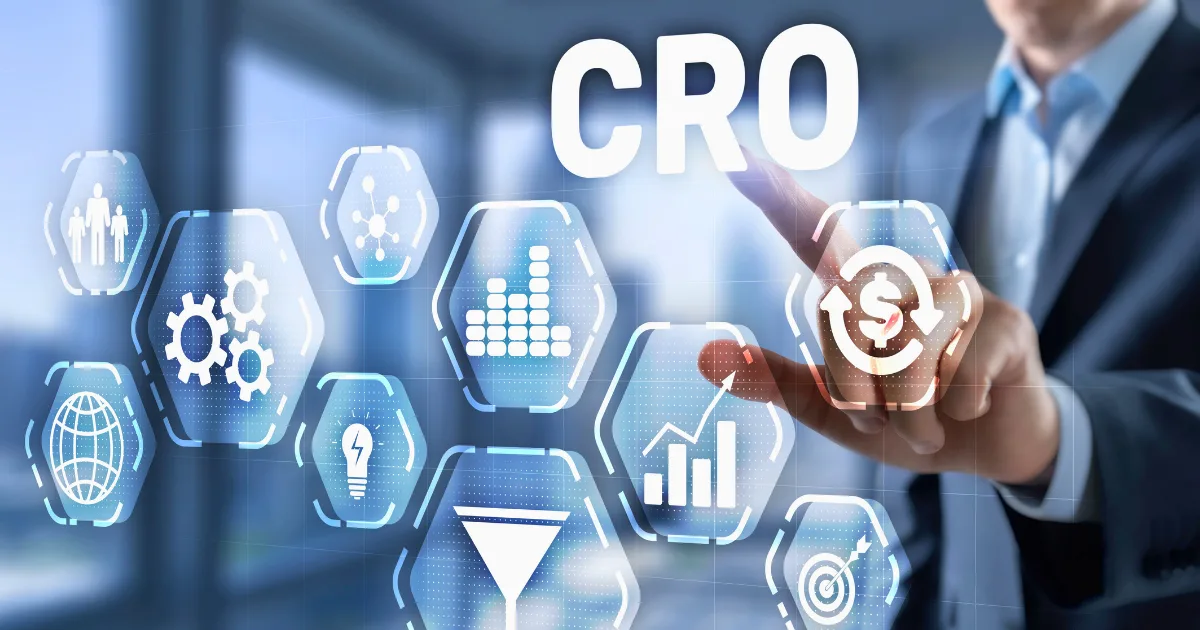A person touches a virtual screen displaying the acronym CRO and icons representing analytics, gears, graphs, a funnel, and a dollar sign, illustrating conversion rate optimization in a modern office—perfect for showcasing a CRO case study.
