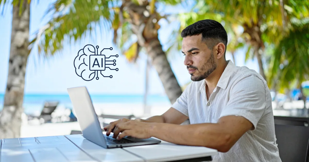 A man works on a laptop at an outdoor table near palm trees and a beach. A digital AI brain icon is superimposed, highlighting his use of an AI productivity stack to accomplish artificial intelligence tasks efficiently.